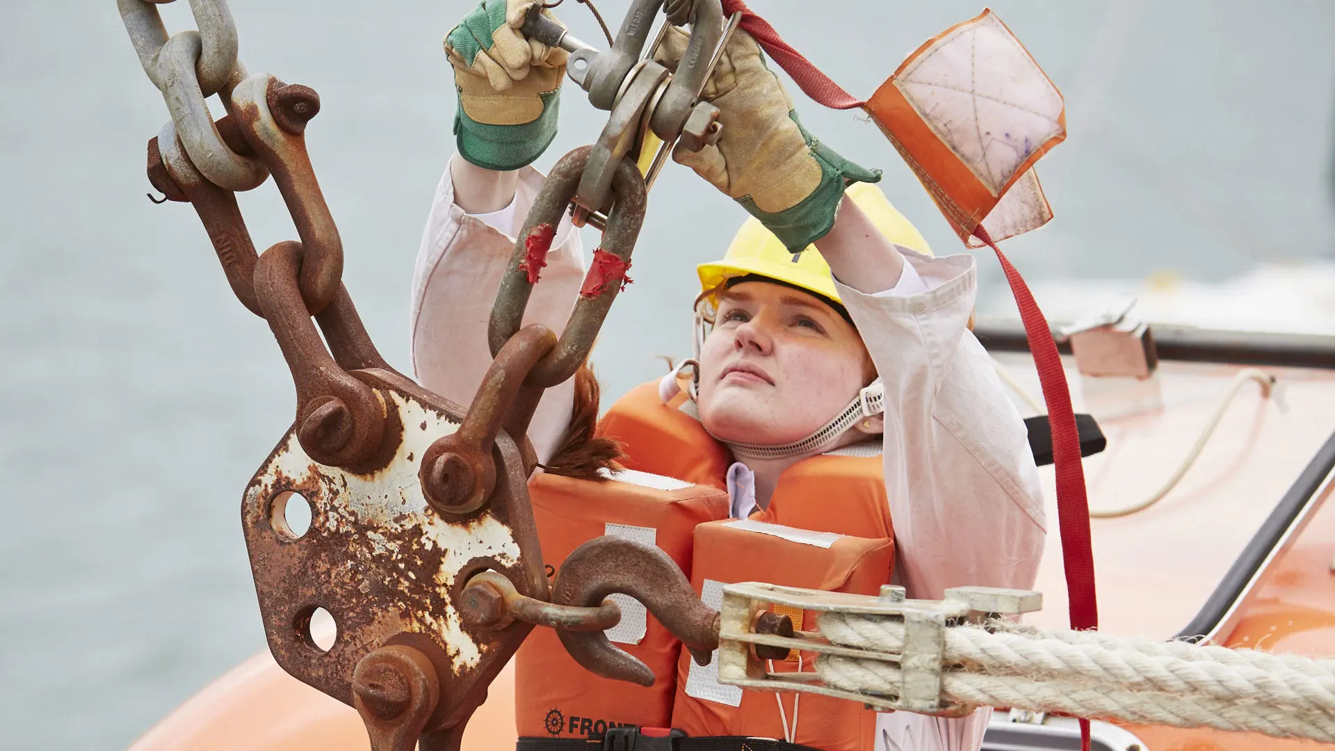 A cadet working on davit fixings