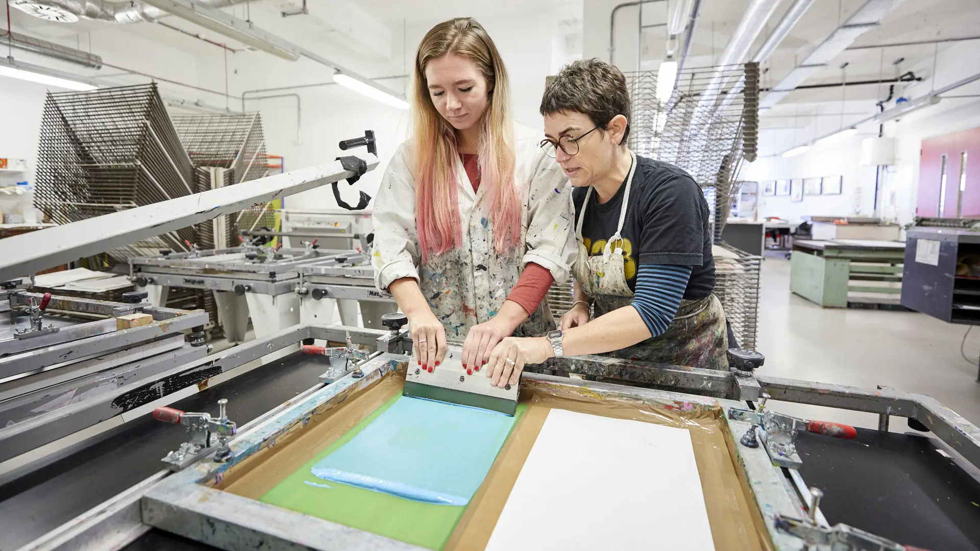 Students screen printing in the print room