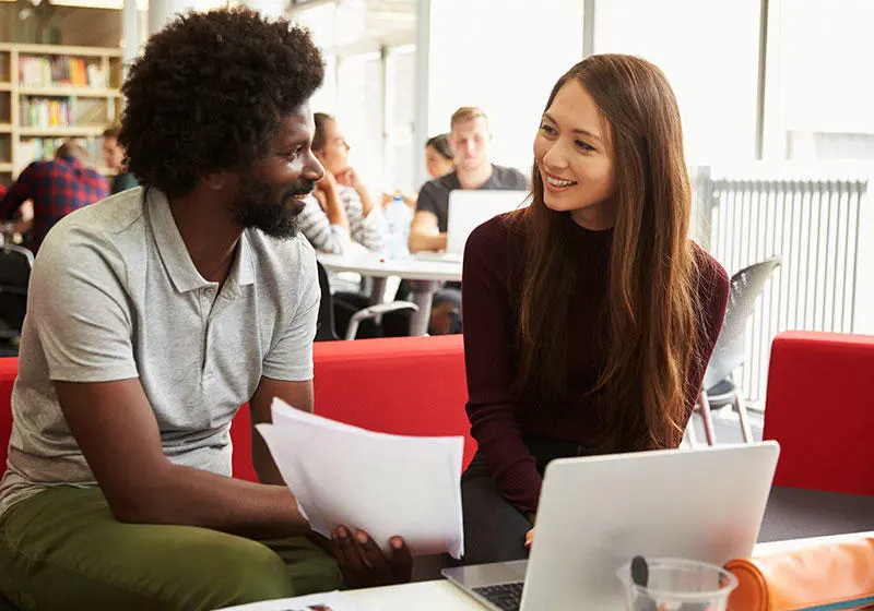 Lecturer talking to a student