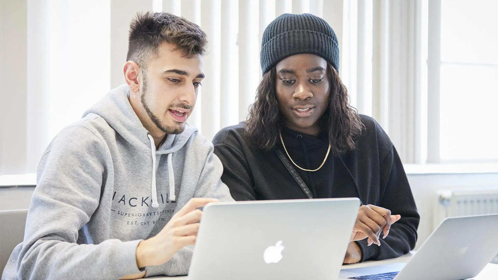 Two student housemates working out the food budget