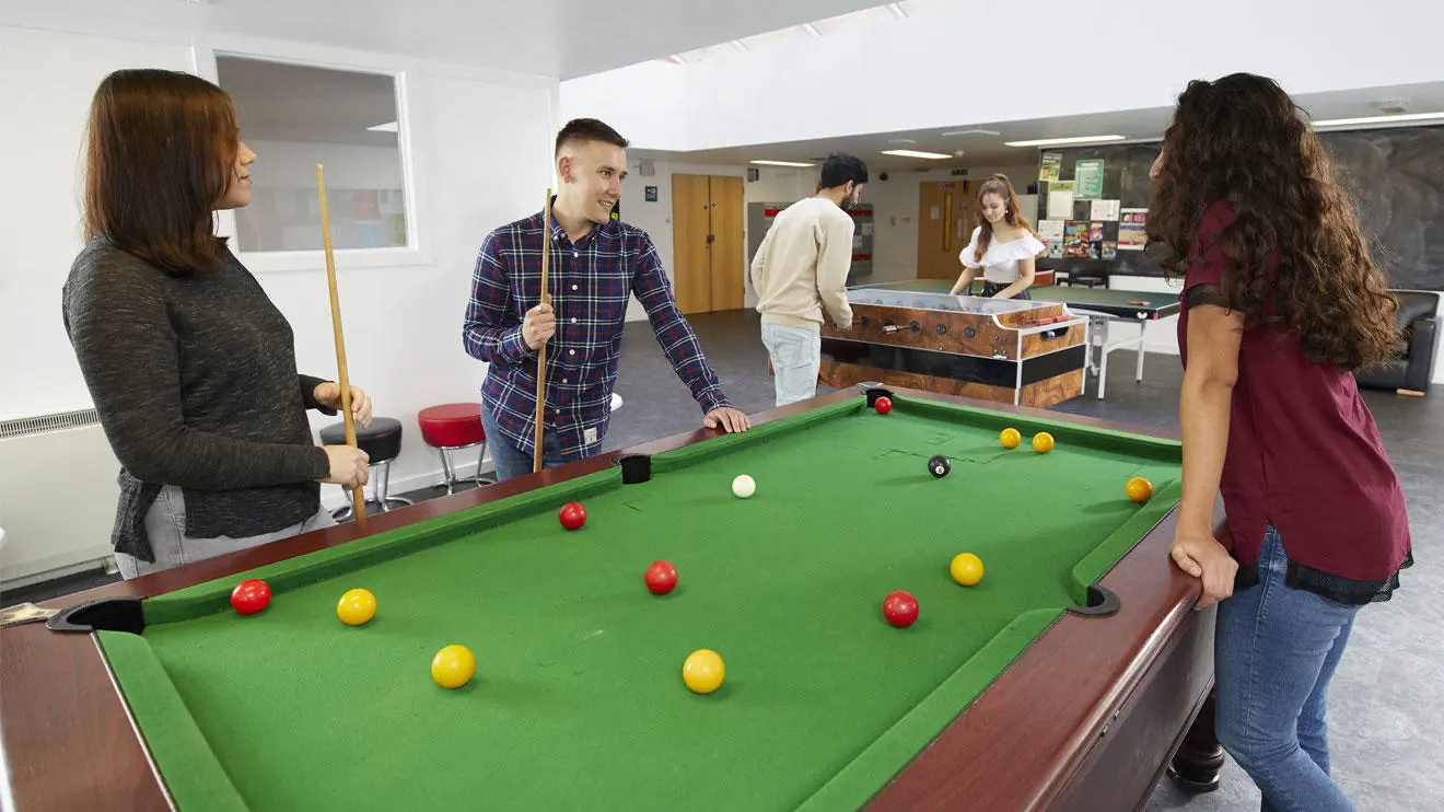 Students playing pool in Chantry residence