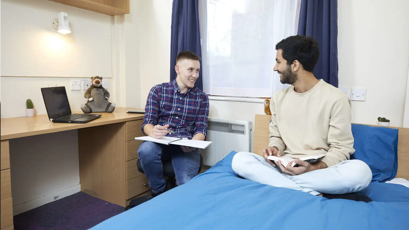 Two male students in a room in Deanery residence