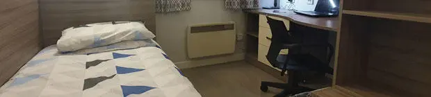 A room in Hamwic student residence with a bed and desk