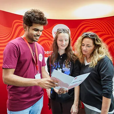 Picture shows student ambassador talking to guests on an open day