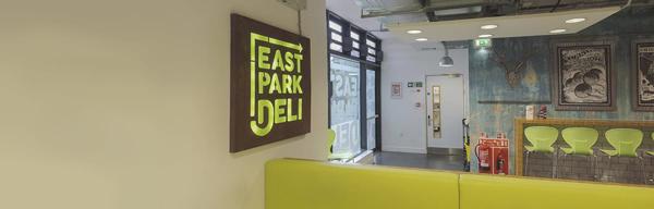 A sign which says East Park Deli