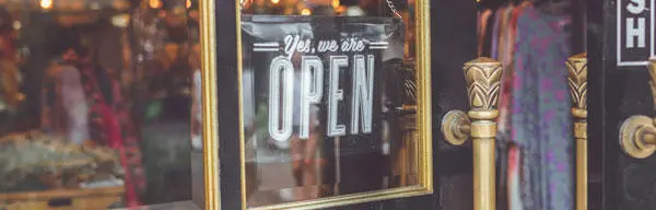 An 'open' sign on a shop door