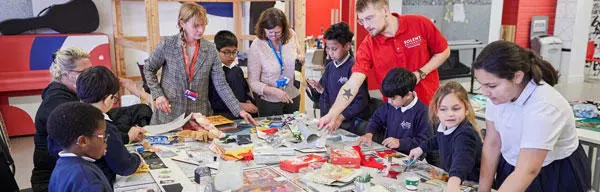 A group of school children with a Solent student ambassador