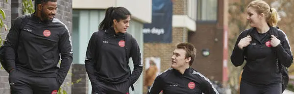 A group of student athletes wearing training kit