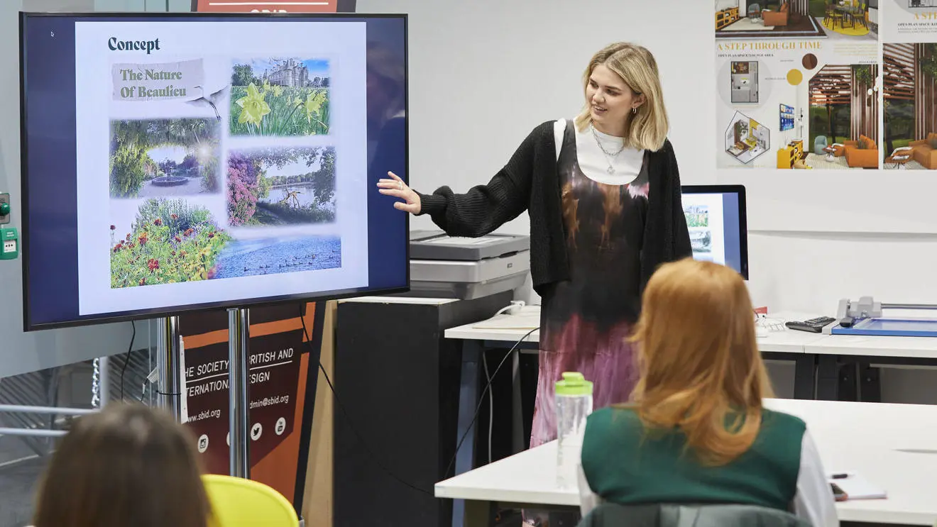 An interior design student giving a presentation