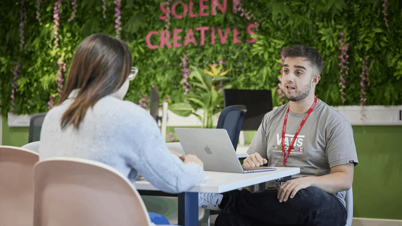 A student talking to someone from Solent Creatives