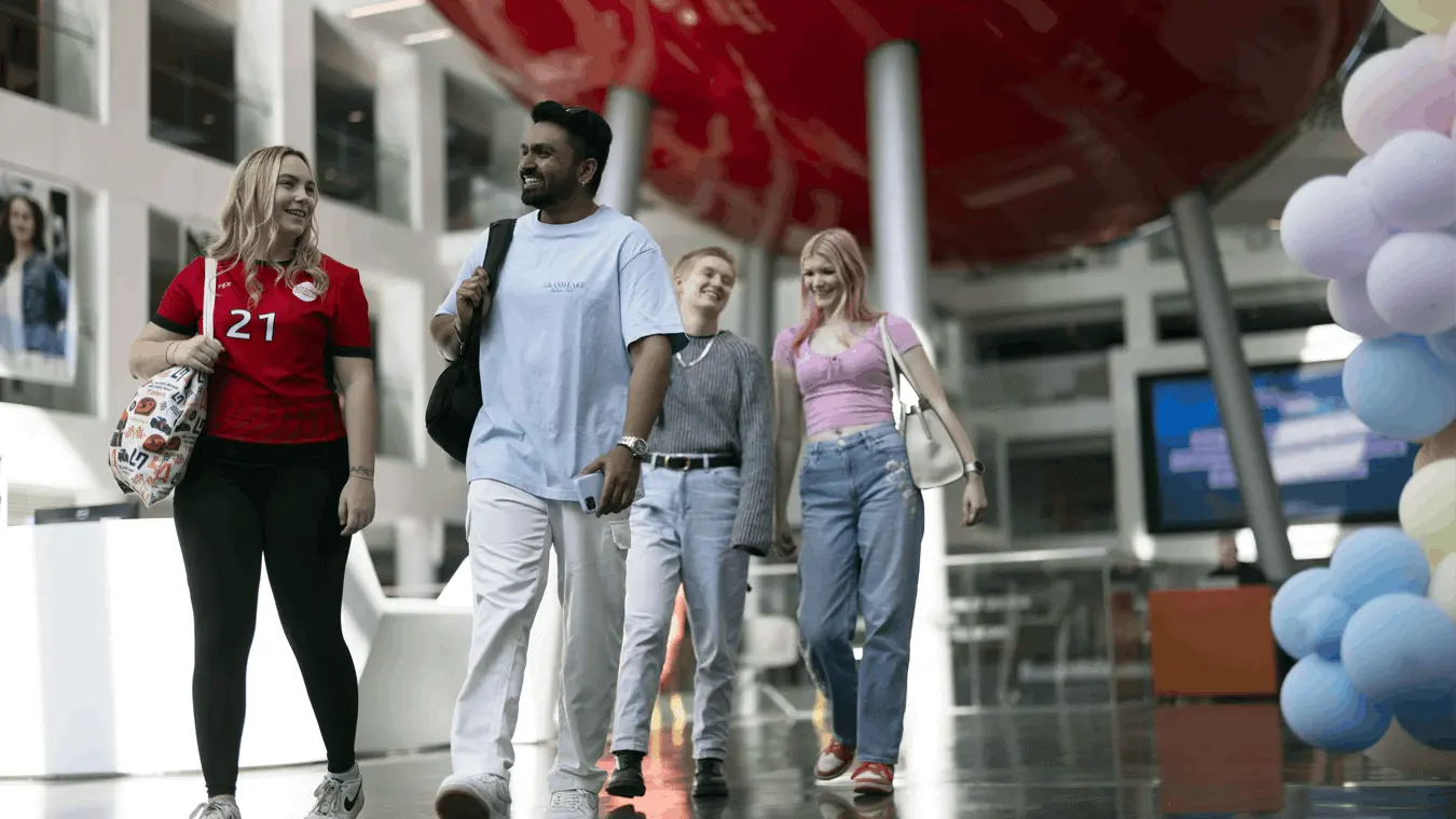 Students walking through the spark atrium