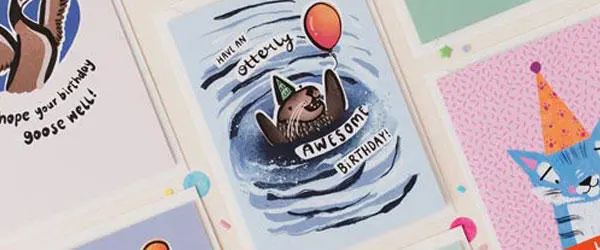 animal illustrations on birthday cards including an otter and a tiger