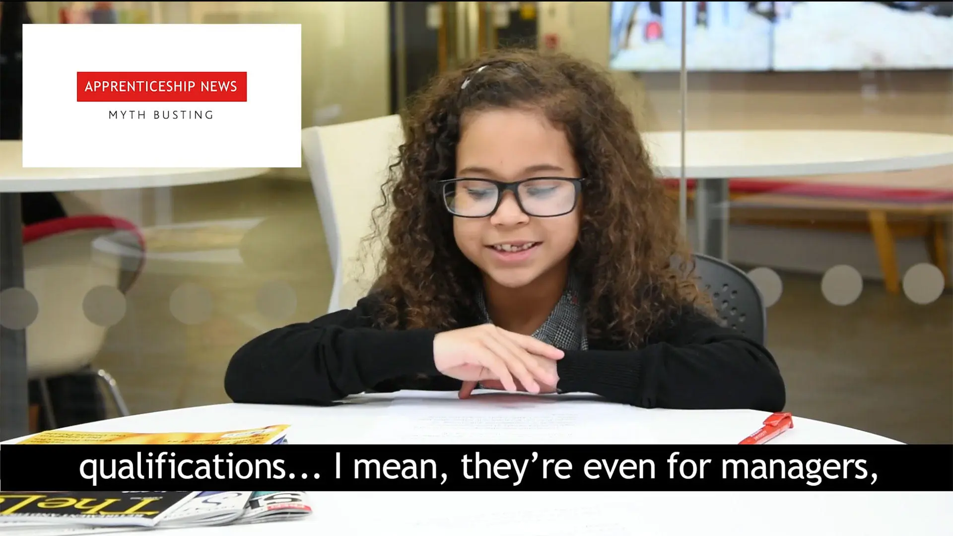 A young girl wearing glasses