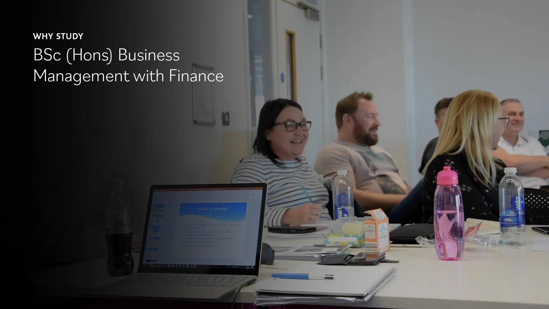 Image of students in a classroom laughing, with words saying: 'Why study BSc (Hons) Business Management with Finance