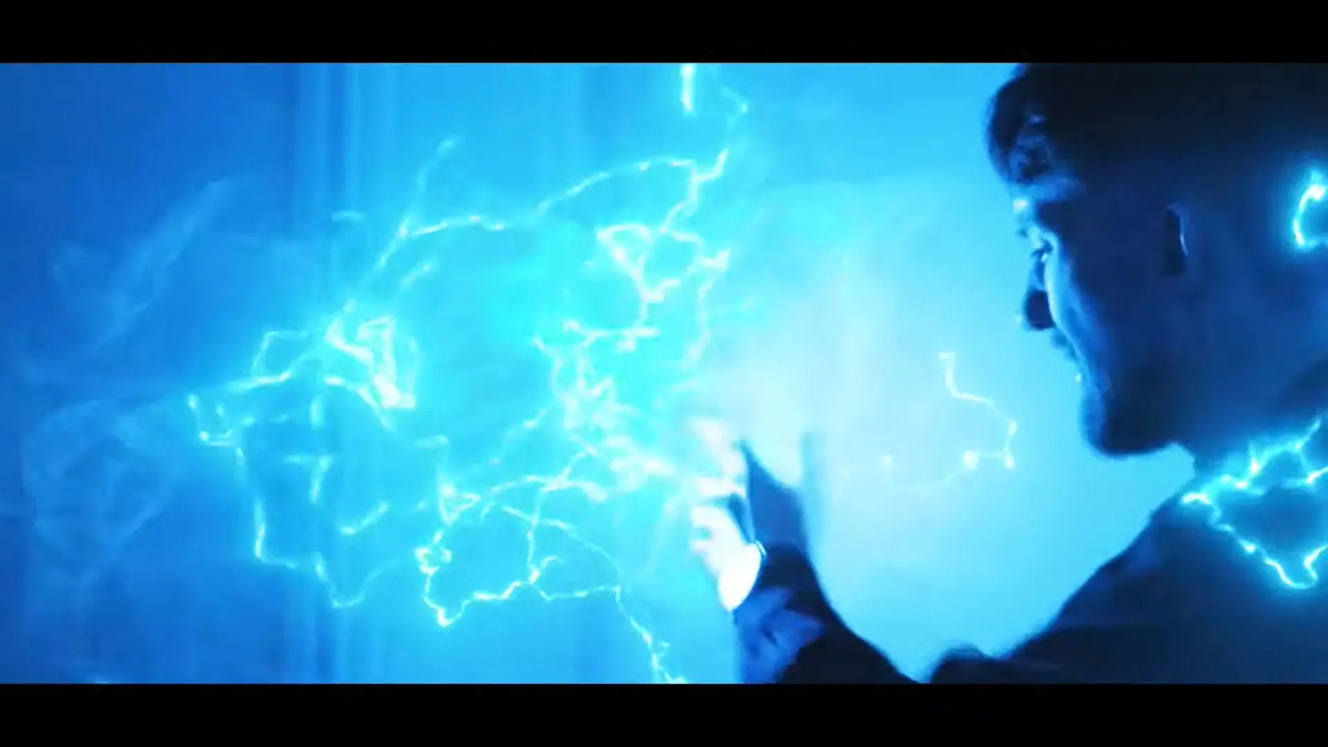 Still from the showreel showing a person putting their hand in electric waves
