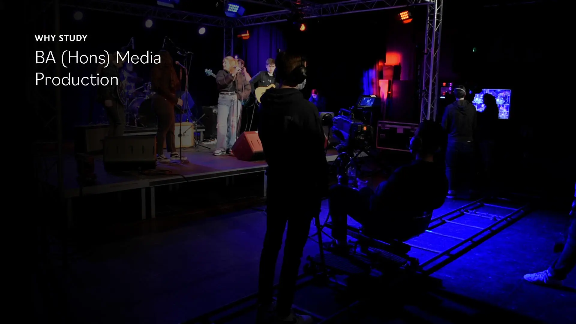 Students in the production studio filming a music video. Cameraman and floor manager. Text reads 'Why study BA (Hons) Media Production'"