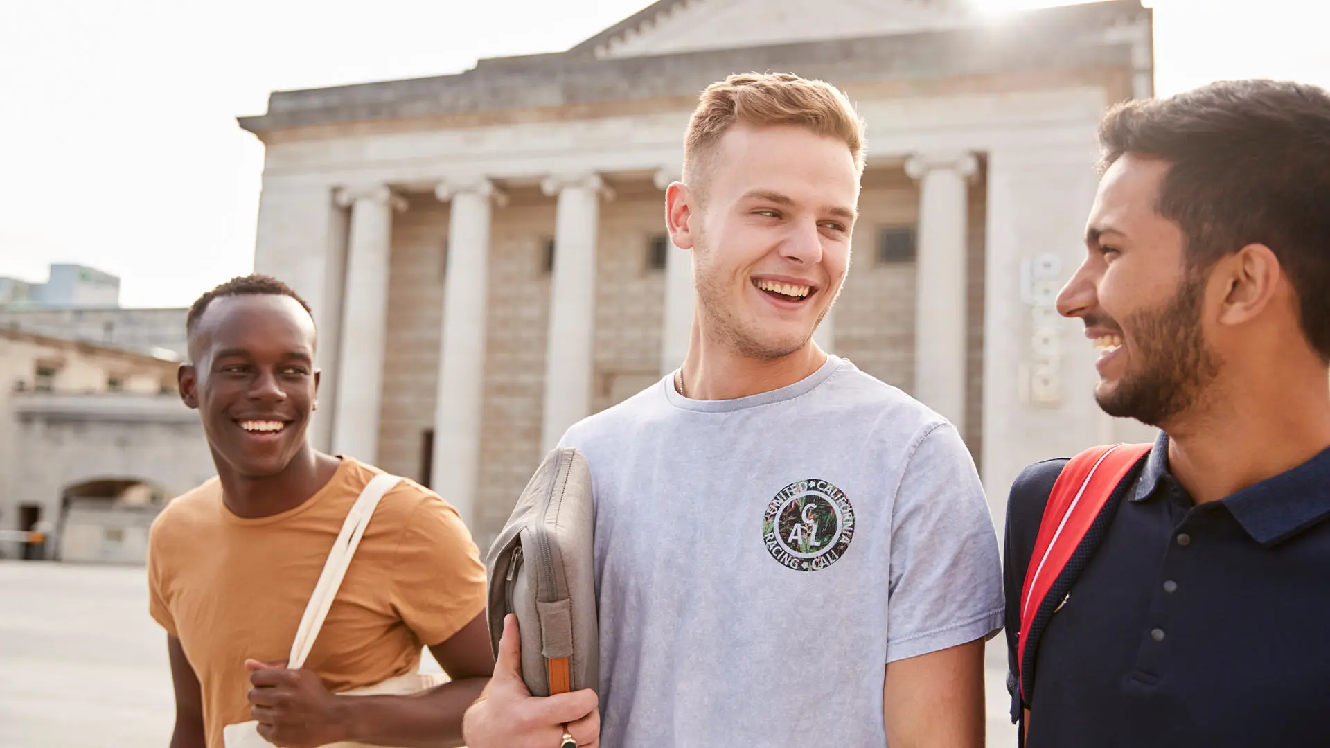 image of students smiling and standing in front of Southampton Guildhall