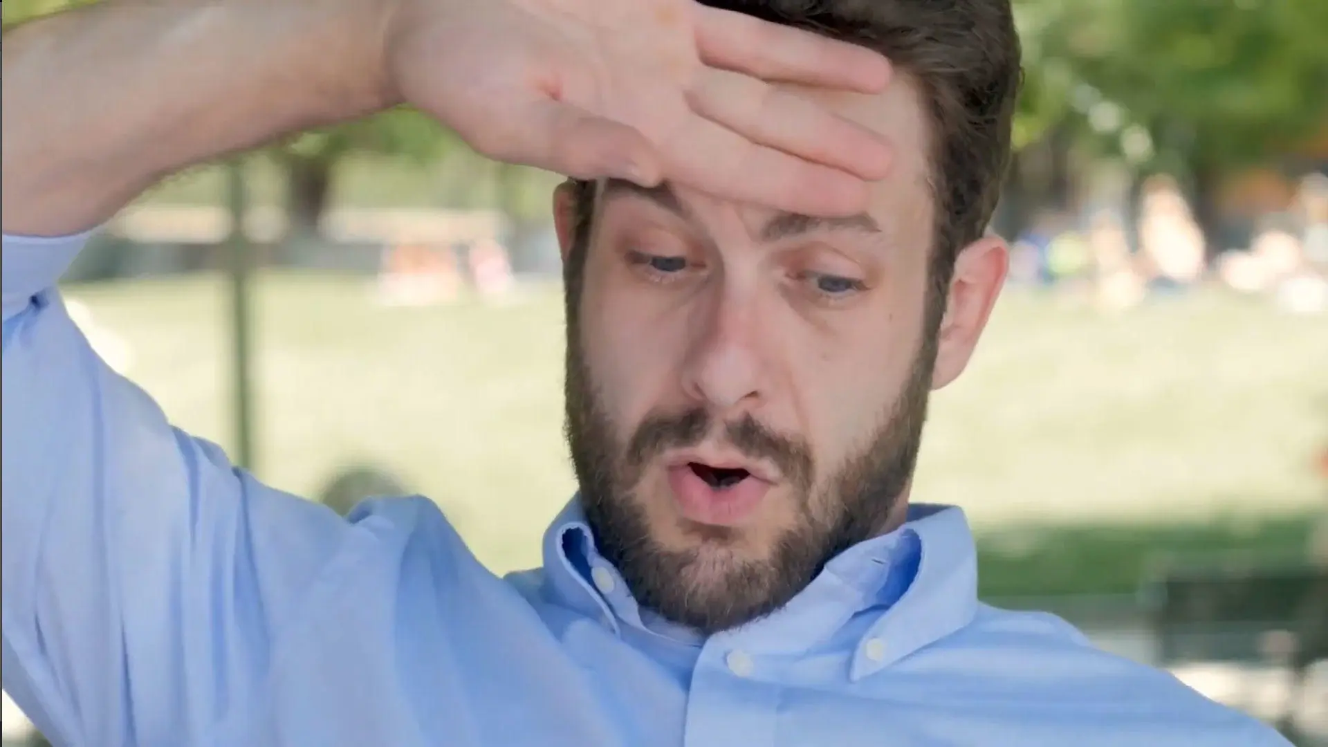 A video thumbnail of A bearded man wiping his forehead with the back of his hand