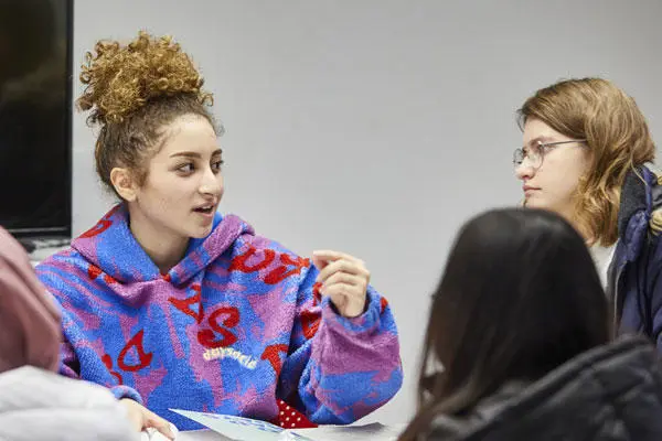 Business and law students talking in a classroom