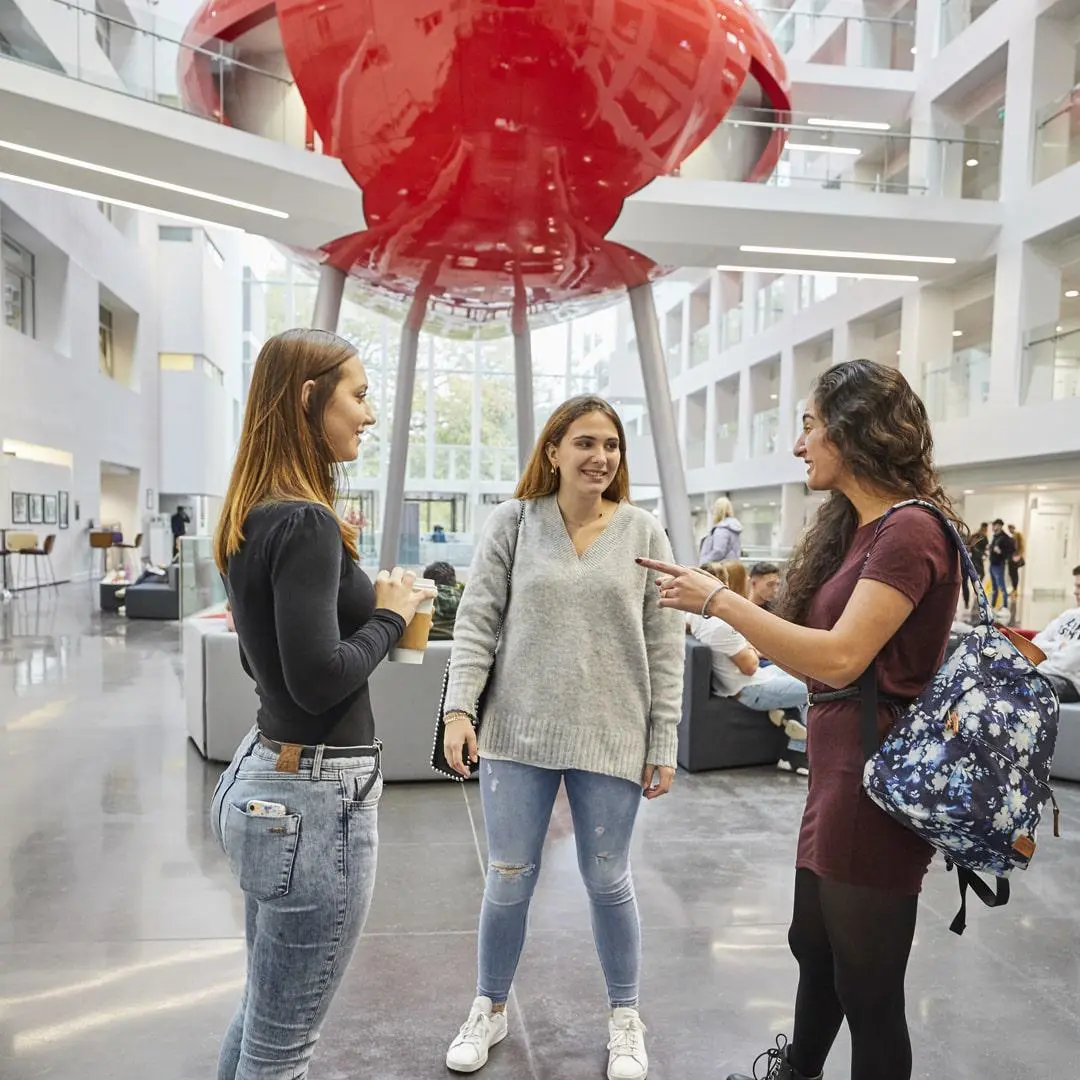 Students talking in the atrium