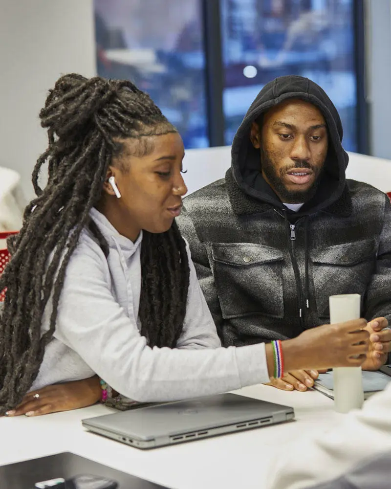 Two business students working on a project