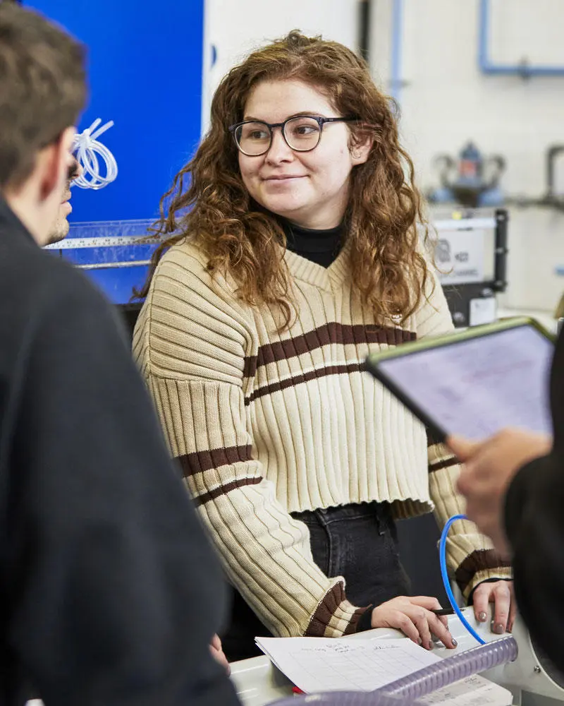 A female engineering student in the engineering lab