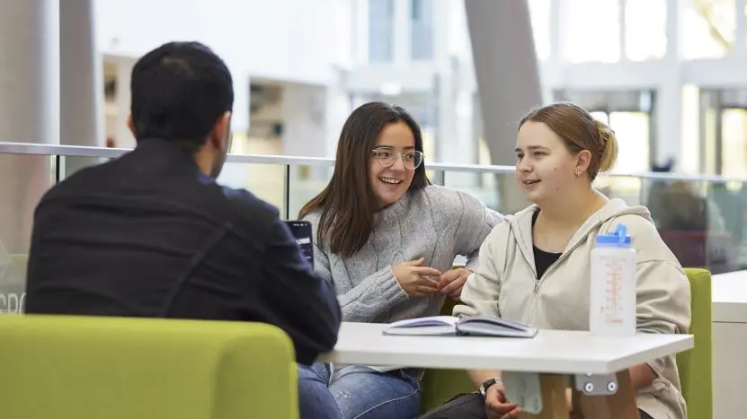 Students talking in the Spark atrium
