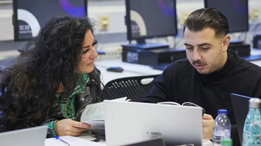 Two students working on a project together