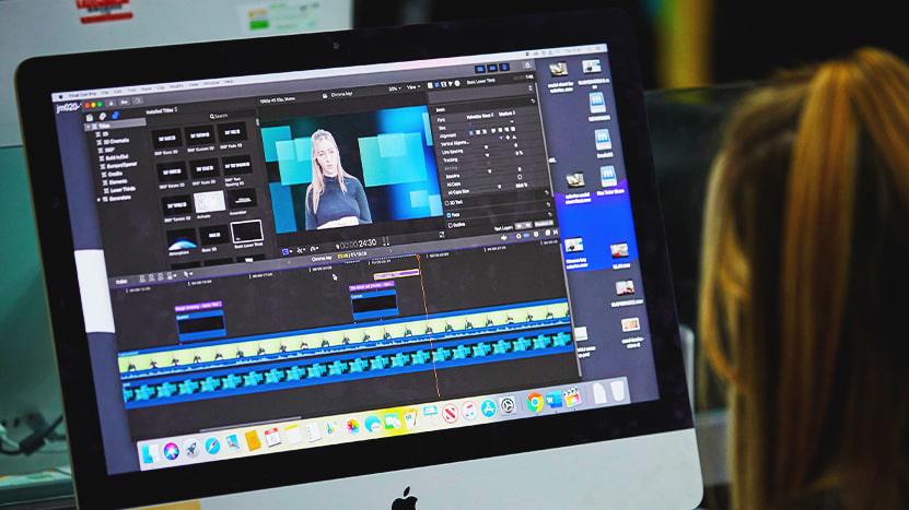 Person editing video on a computer