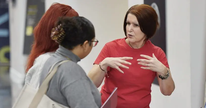 Solent staff member talking to a student