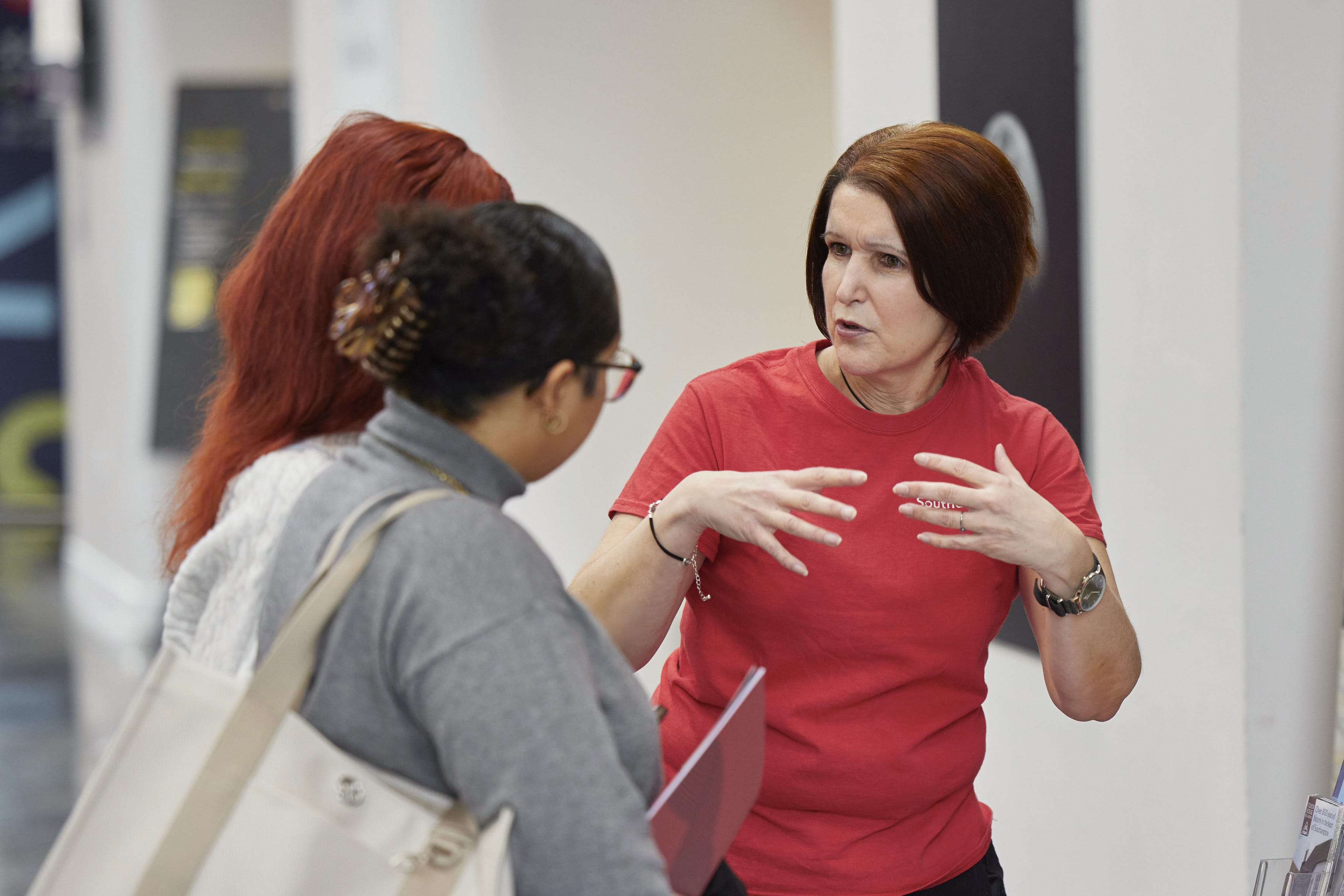 Solent staff member talking to a student