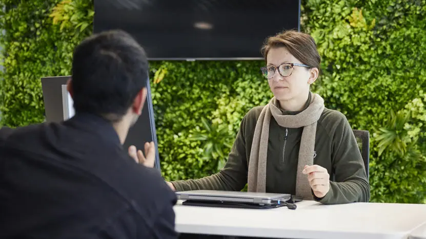 A female student smiling at the camera