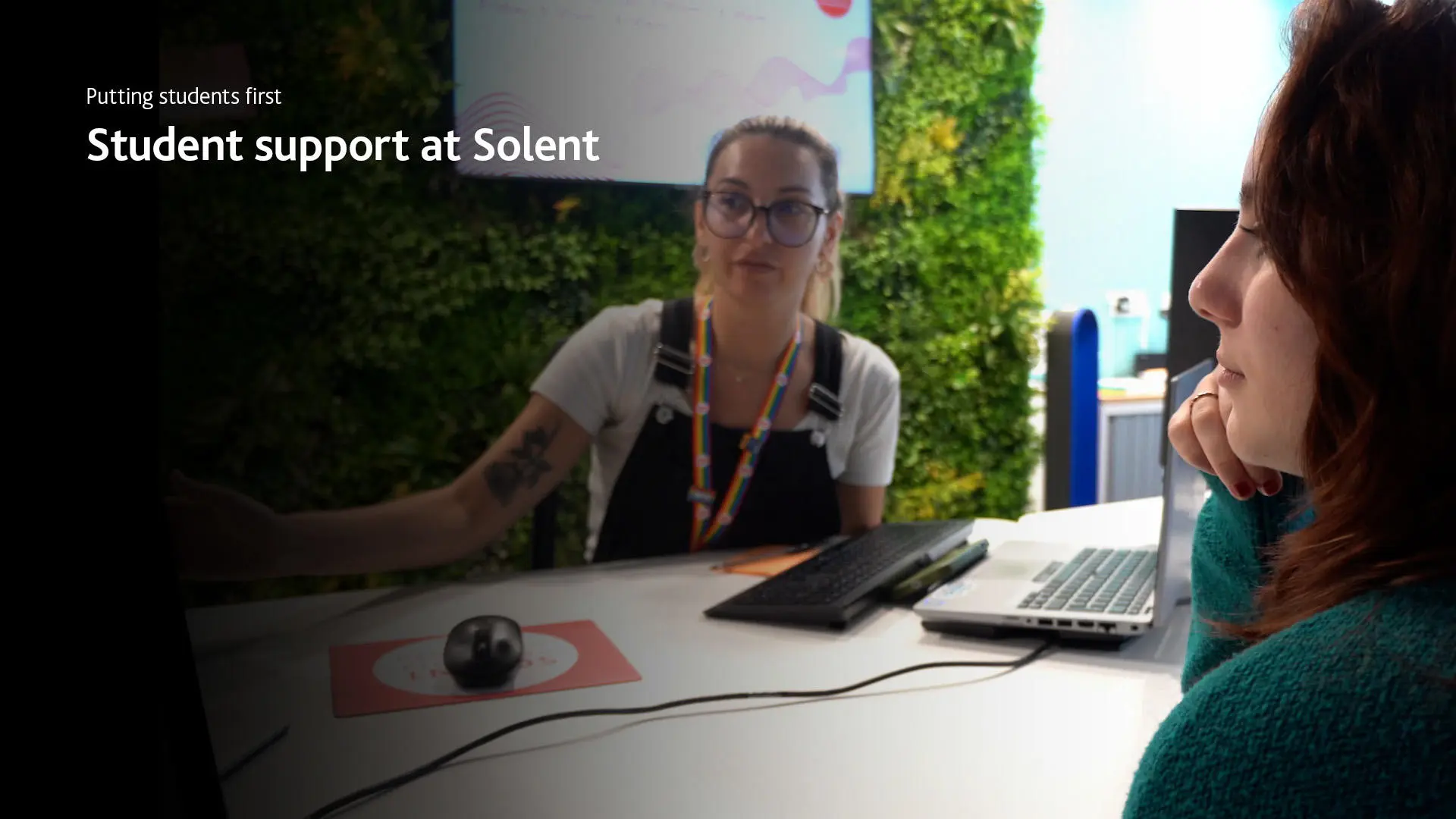 Screen shot of a student support staff member talking to a student
