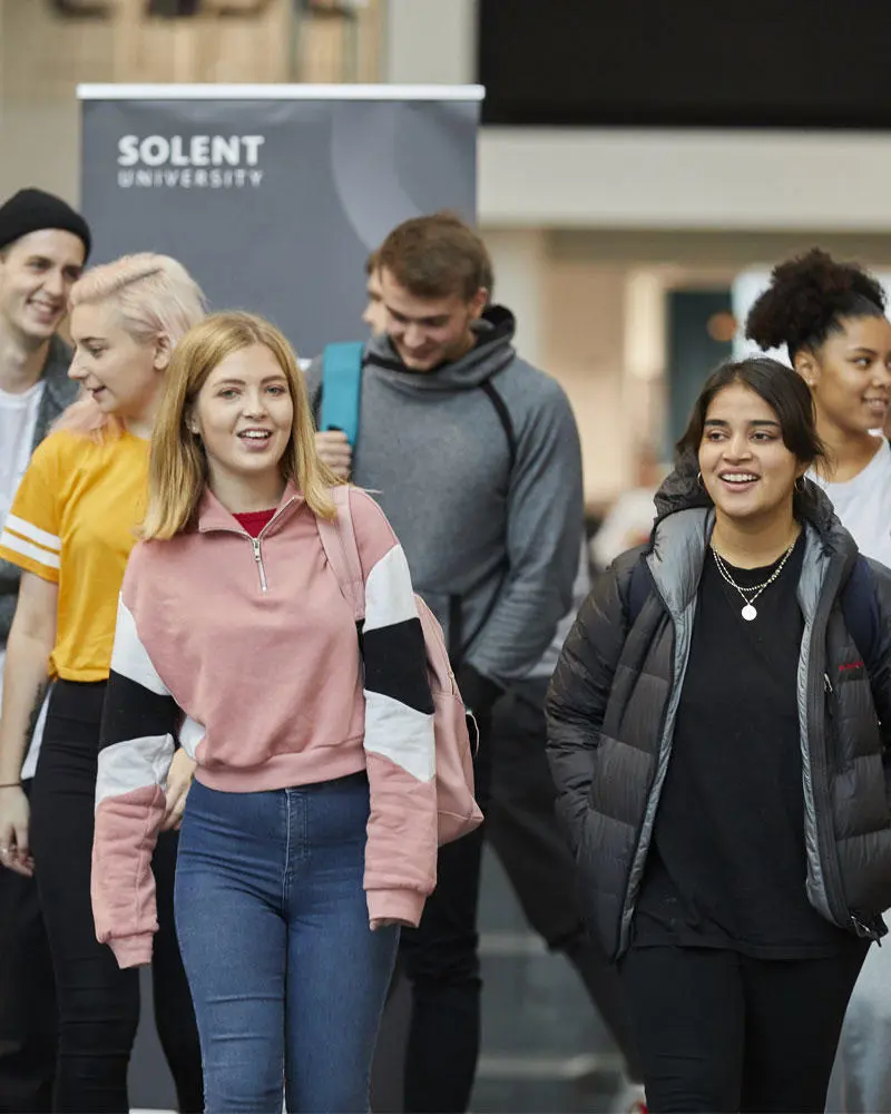 A group of students walking through The Spark
