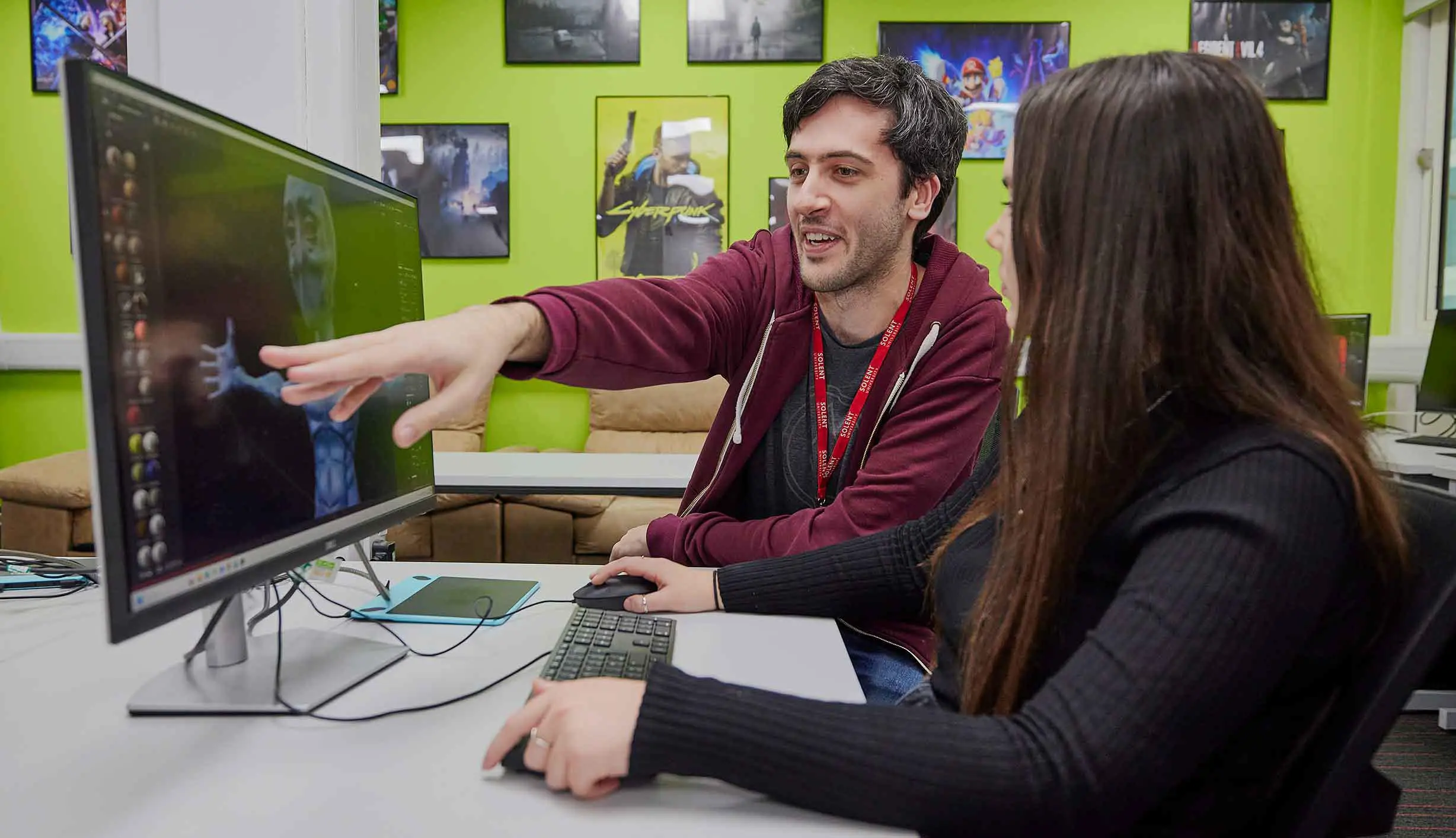 Lecturer teaching an animation student