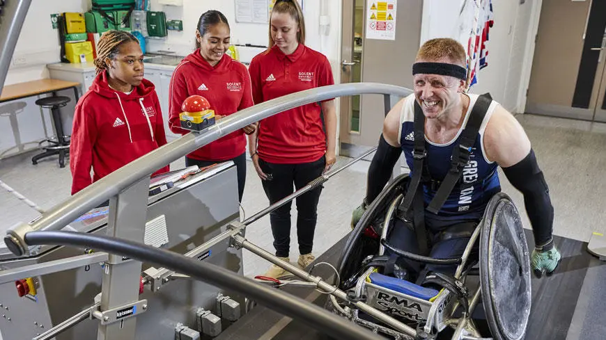 Students in the sport science lab with GB wheelchair rugby athlete, Aaron Phipps