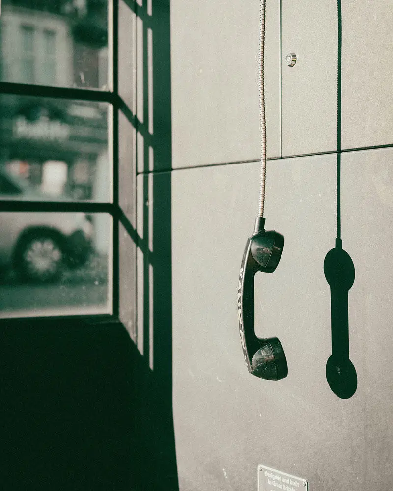 No Response by Aleksandrs Puhovs - image shows an old-style telephone receiver dangling on a wire