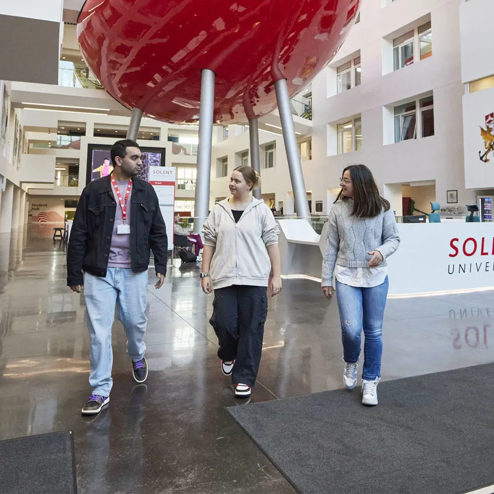 Students walking down a corridor