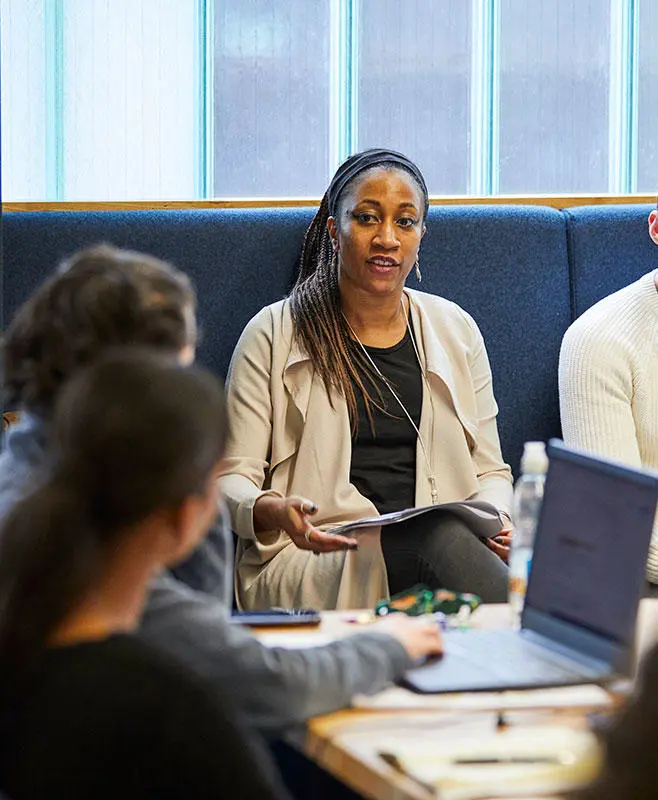 A group of people in a meeting