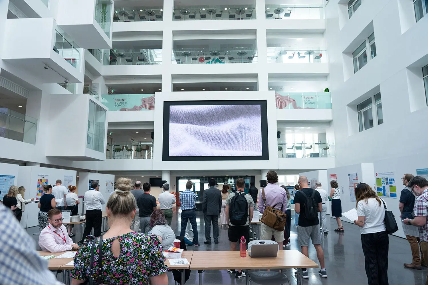 Conference attendees in The Spark Atrium
