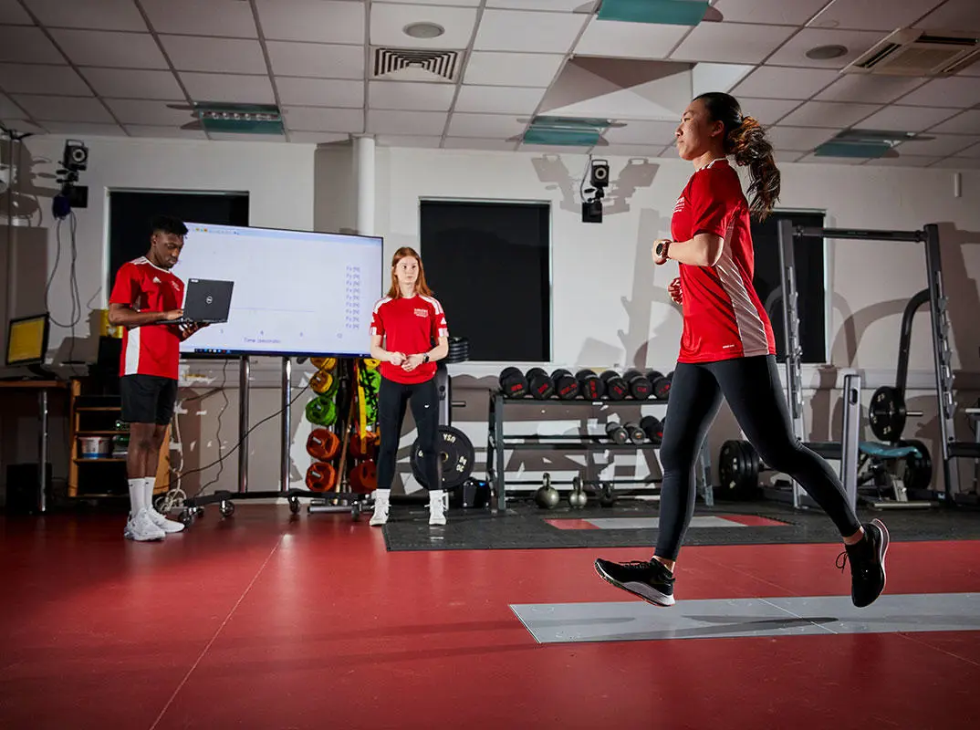 Three students in the sport science lab