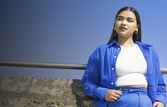 Solent student stood against a blue sky 