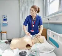 A female nurse with a medical dummy