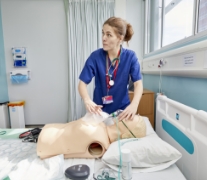 A female nurse with a medical dummy