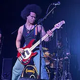 Darius Oloro playing guitar on stage