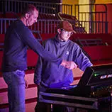 Music technician teaching student