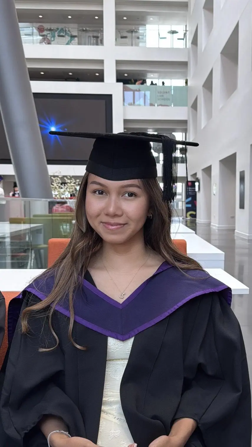 Vy Huynh at graduation, in her robes
