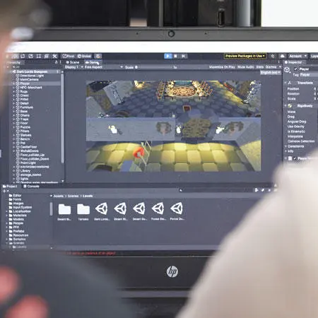 Students working with computer games software