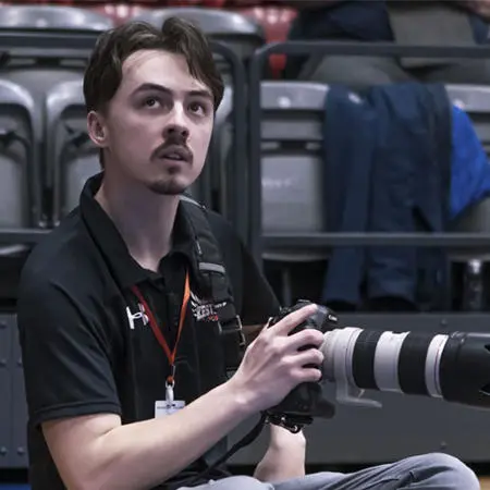 Image of Luck Simcock with a camera