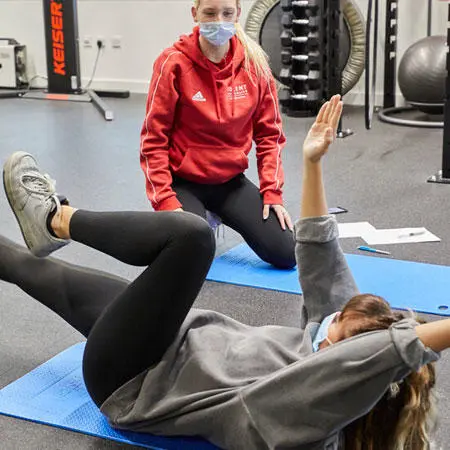 Two physical education students in the gym